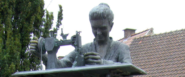 Statue of a seamstress in Sint-Blasius
